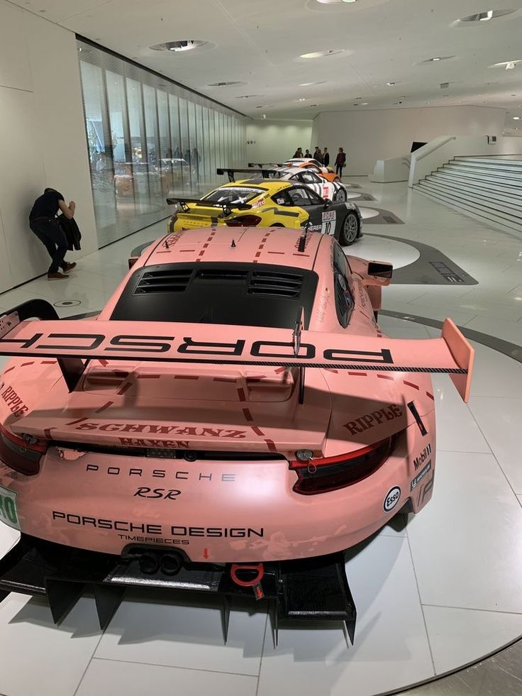 porsche cars are on display in the showroom