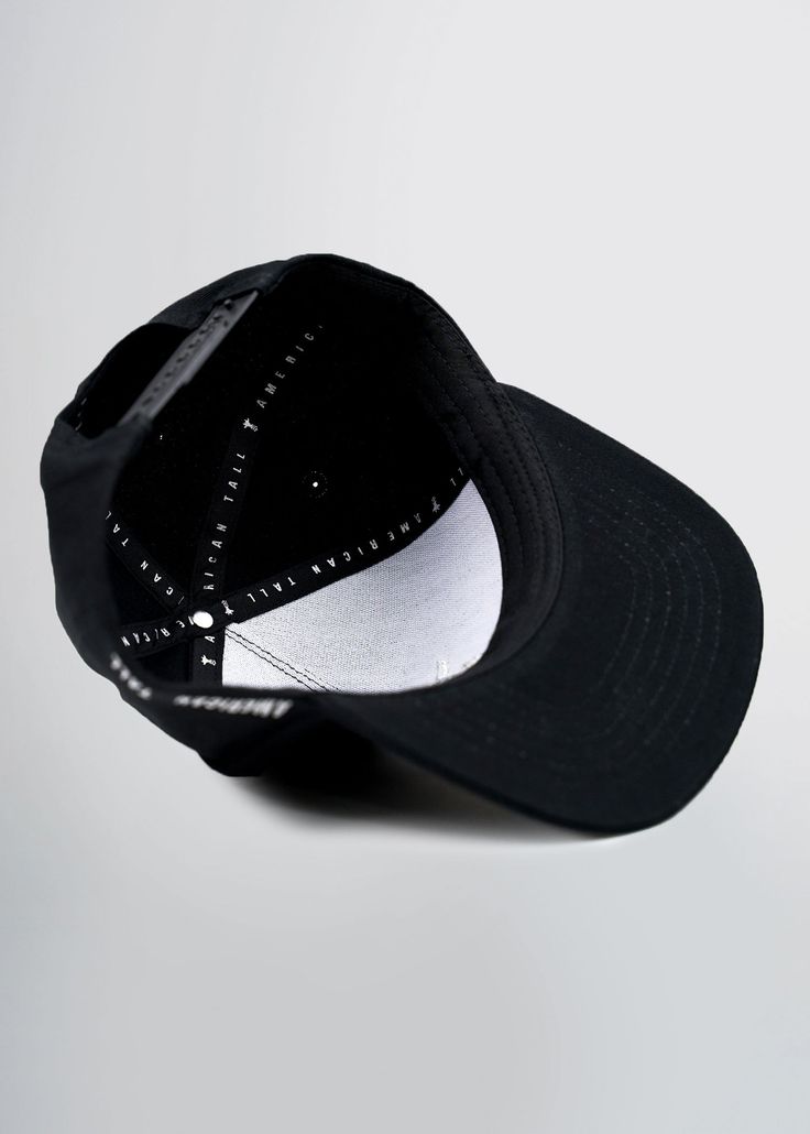 The American Flat Billed Cap in Black. Adjustable, close fitting cap with flat bill. Black, featuring embroidered American Tall logo. Snap closure back. For hygienic reasons, hats are FINAL SALE. MORE DETAILS:We like what we do, and you do too. You’re already donning tees and jeans that fit better than you could have possibly imagined. And sure, maybe finding a hat that fits isn’t so difficult. But here’s an opportunity to rep’ your favorite brand while you’re out with your crew. Wear it with pr Adjustable Black Baseball Cap With Embroidered Logo, Black Snapback Hat For Streetwear, One Size, Black Embroidered Logo Baseball Cap, Adjustable Black Baseball Cap With Flat Brim, Urban Black Dad Hat With Embroidered Logo, Flat Cap Fitted Hat With Embroidered Logo For Streetwear, Black Adjustable Flat Brim Baseball Cap, Adjustable Black Flat Brim Baseball Cap, Fitted Flat Cap With Embroidered Logo For Streetwear