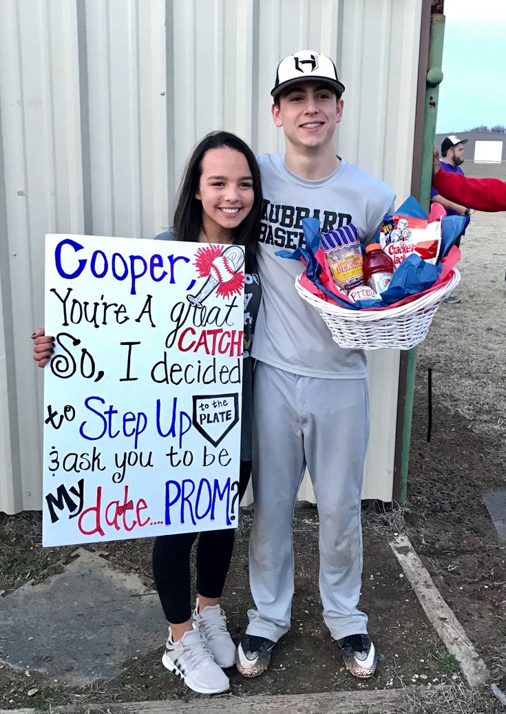 two people standing next to each other with signs on their backs and one holding a sign that says, cooper you're a girl so i decided to step up