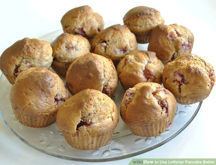 a plate full of muffins sitting on top of a table