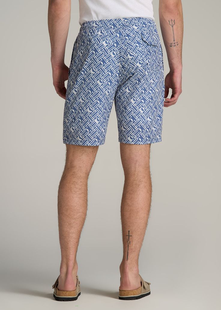 Make a Splash: Essential Swim Trunks for Tall Guys Dive Into Comfort & Style Ready to dive into summer? Our Volley Swim Shorts are here to ensure you do it in style. Crafted from quick-drying woven fabric, these tall men's swim trunks are designed for the guy who's ready to comfortably go from pool to party, featuring a stretch waistband with an external drawstring for a perfect, secure fit. Whether you're hitting the waves or lounging poolside, the above-knee length offers the ideal balance of Blue Bermuda Swim Trunks For Summer, Blue Stretch Cotton Swim Trunks, Navy Stretch Bottoms For Summer, Navy Slim-fit Bottoms For Vacation, Navy Bottoms For Pool And Summer, Navy Bottoms For Summer Vacation, Navy Bermuda Bottoms For Summer, Fitted Cotton Swim Trunks For Poolside, Casual Fitted Shorts For Pool