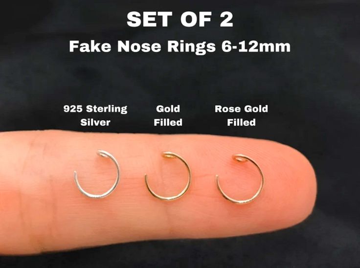 three pairs of fake nose rings are shown in different sizes and colors, including gold or silver