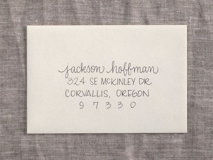 a close up of a piece of paper with writing on it and an address stamp