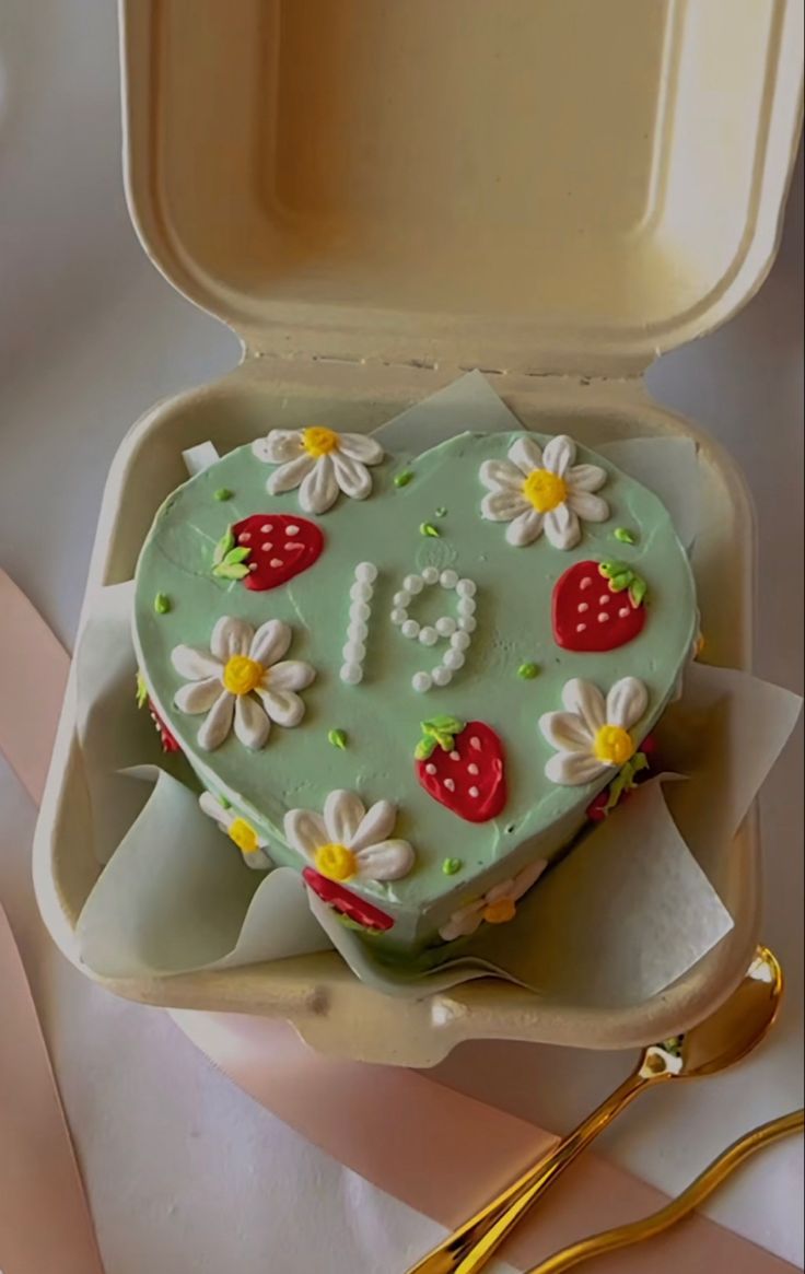 a heart shaped cake in a box on a table