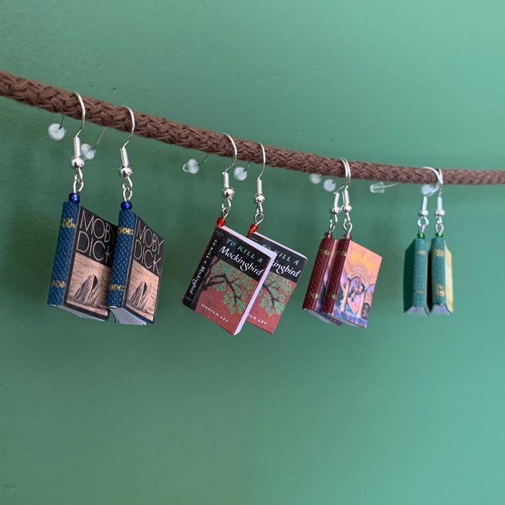 Earrings made of cute mini books. They can be custom made with the cover of your favorite book, and you can actually write in the pages! Great to show off your love for books or to have nearby in case you need to write down some secret little notes. The order is for one pair, the hooks are sterling silver and hypoallergenic and the cover can be made as any title you want. Mini Book Earrings, Book Earrings, Book Jewelry, Funky Earrings, Mini Book, Funky Jewelry, Boston Ma, Bijoux Diy, Jewelry Inspo