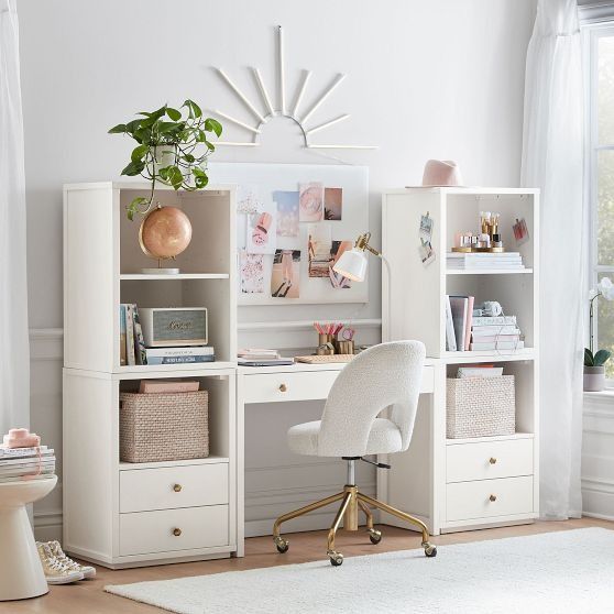 a white desk and chair in a room