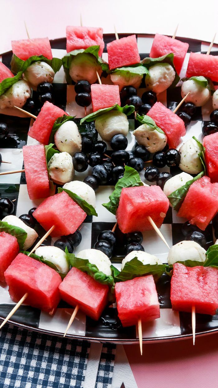 watermelon and olive skewers on a platter