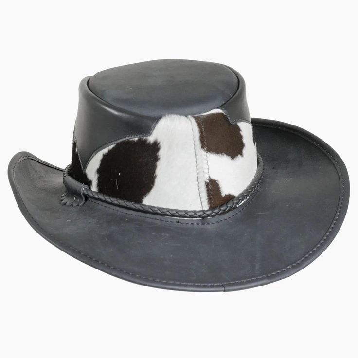 Pinto | Mens Leather Cowboy Hat with Calf Accents blends rugged cowhide and hair-on calfskin for a distinctive, bold look. The triple-braided band with tassel adds a unique touch, making this Outback hat perfect for outdoor adventures. Material: Genuine Leather with Hair-On Calfskin Shape: Outback Trim: Triple-Braided Band with Tassel Brim Size: 3” Crown Height: 4” Sweatband: AHM Velcro Assembled in the USA Country Style Brimmed Top Hat For Ranch, Brown Western Top Hat For Outdoor, Leather Brimmed Fedora For Rodeo, Western Brown Top Hat For Ranch, Brown Western Style Top Hat For Ranch, Western Brimmed Top Hat For Ranch, Western Leather Fedora With Flat Brim, Western Style Leather Fedora With Flat Brim, Country Style Wide Brim Hat With Leather Sweatband