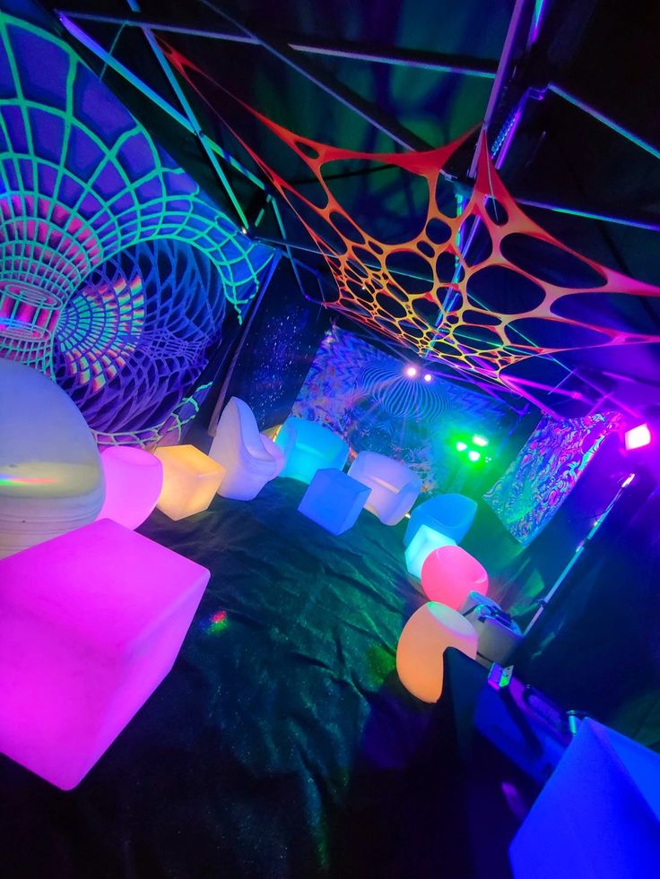 the inside of a tent with colorful lights