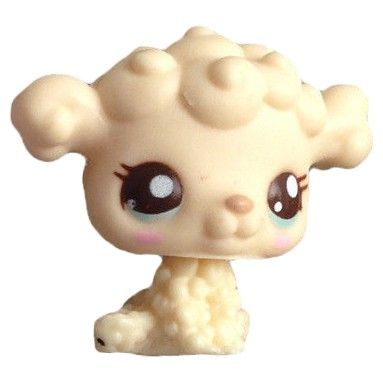 a close up of a small toy animal with big eyes and large hair on it's head