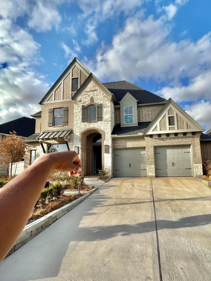 a person is taking a photo of a house