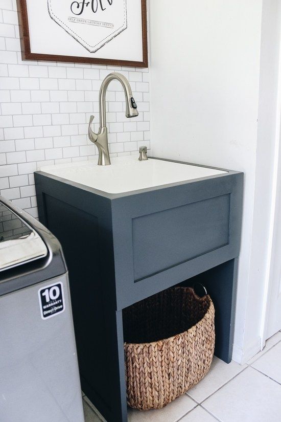 a laundry room with a sink and washing machine