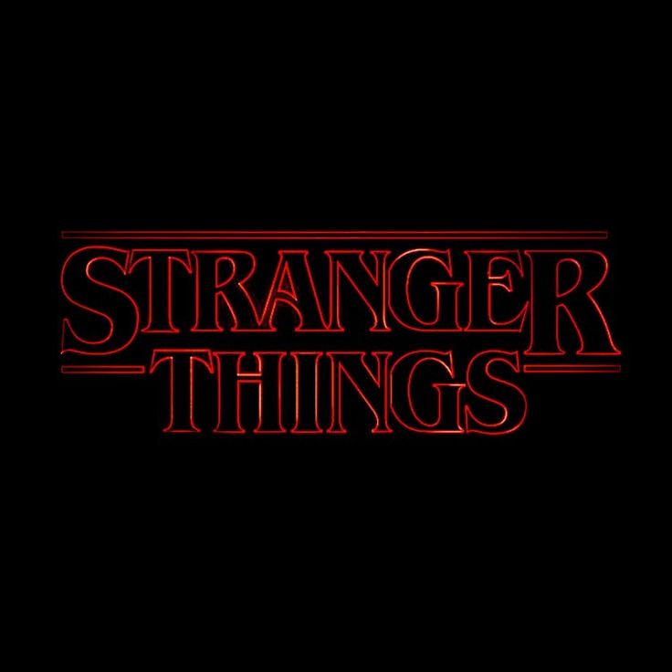 the title for the tv series, strange things is shown in red letters on a black background