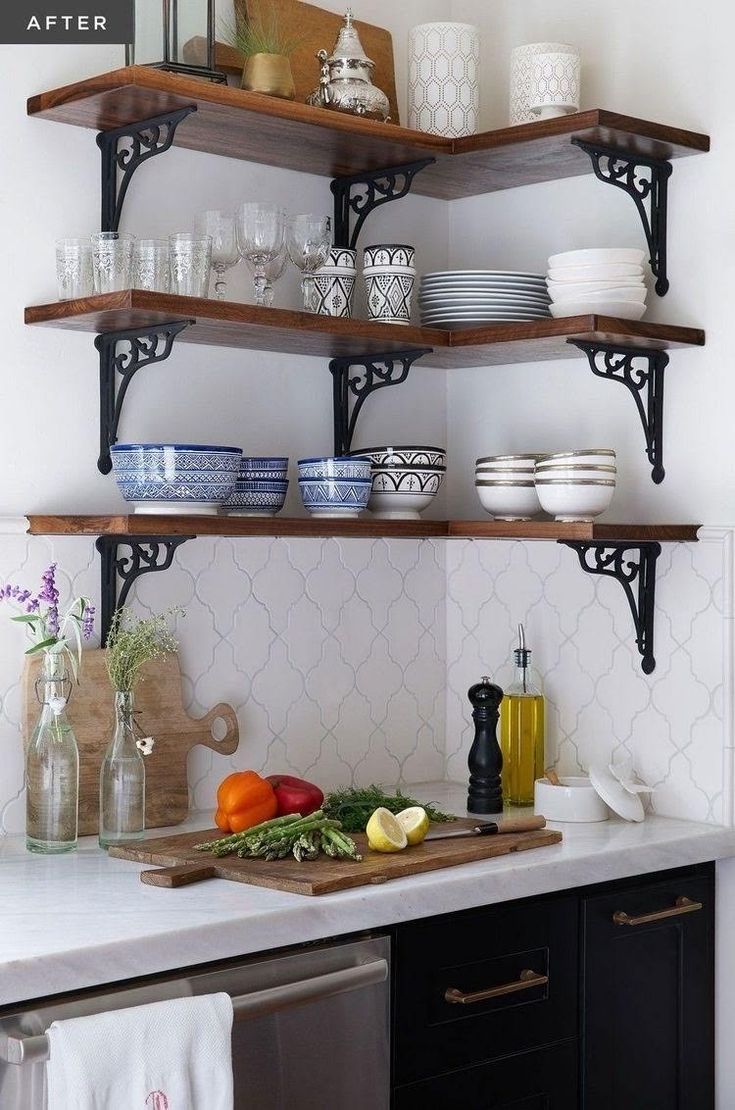 the shelves in the kitchen are filled with dishes