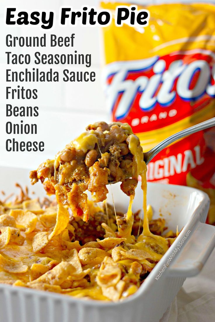 a casserole dish with ground beef and cheese being lifted from the casserole