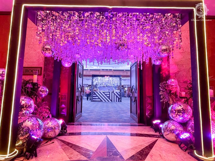 an entrance decorated with pink and purple decorations