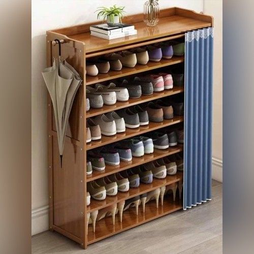 a wooden shoe rack filled with lots of shoes