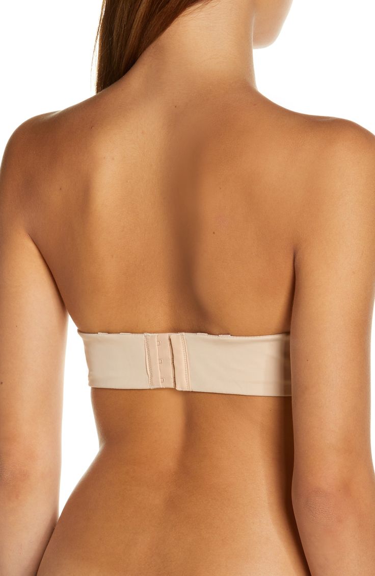 Wear this seamless bra however you want with removable straps and a design that disappears under your clothes. Strapless Removable soft cups 75% polyamide, 25% elastane Hand wash, line dry Imported Elegant Stretch Tube Top, Bra-friendly, Elegant Stretch Bra Friendly Tube Top, Beige Bandeau Bra, Strapless Fitted Nursing Bra With Built-in Bra, Stretch Bra With Removable Cups, Elegant Stretch Tube Top With Removable Bra Pads, Adjustable Strapless Tube Top, Strapless Seamless Nursing Bra, Seamless Strapless Nursing Bra