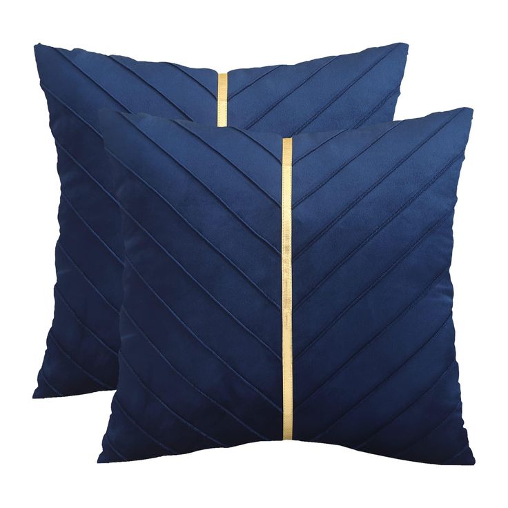 two blue pillows with gold lines on them