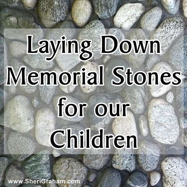 some rocks with the words laying down memorial stones for our children