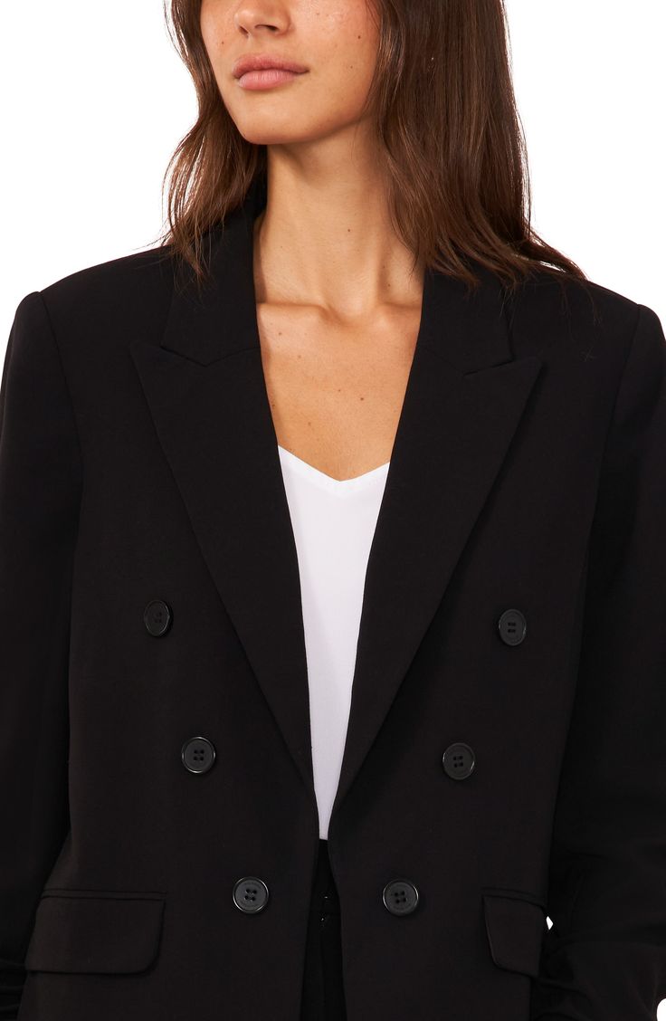 This polished blazer is designed in a double-breasted silhouette with peaked lapels and six-button cuffs. 27" length (size Medium) Peaked lapels Six-button cuffs Lined 63% polyester, 33% rayon, 4% spandex Dry clean Imported Sleek Double-breasted Semi-formal Outerwear, Classic Black Blazer Dress For Work, Black Notch Lapel Blazer Dress For Career, Classic Black Career Blazer Dress, Double-breasted Tuxedo Blazer For Workwear, Sleek Blazer Dress For Work With Double Button Closure, Tuxedo-style Structured Blazer With Double Buttons, Workwear Tuxedo Blazer With Double Button Closure, Sleek Formal Outerwear With Double Button Closure