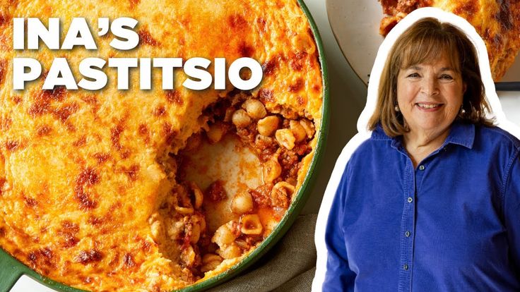 a woman standing in front of a casserole dish with the words ina's pastitsio on it