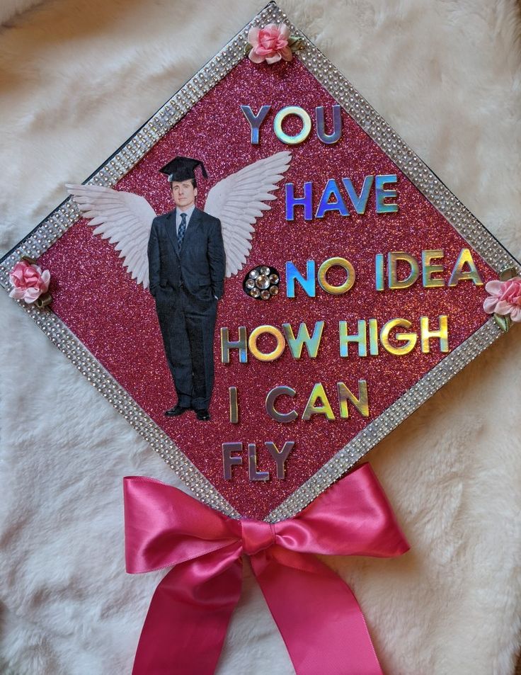 a graduation cap with an image of a man in a suit and tie on it