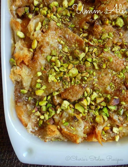 a casserole dish with nuts and pistachios in it on a white plate