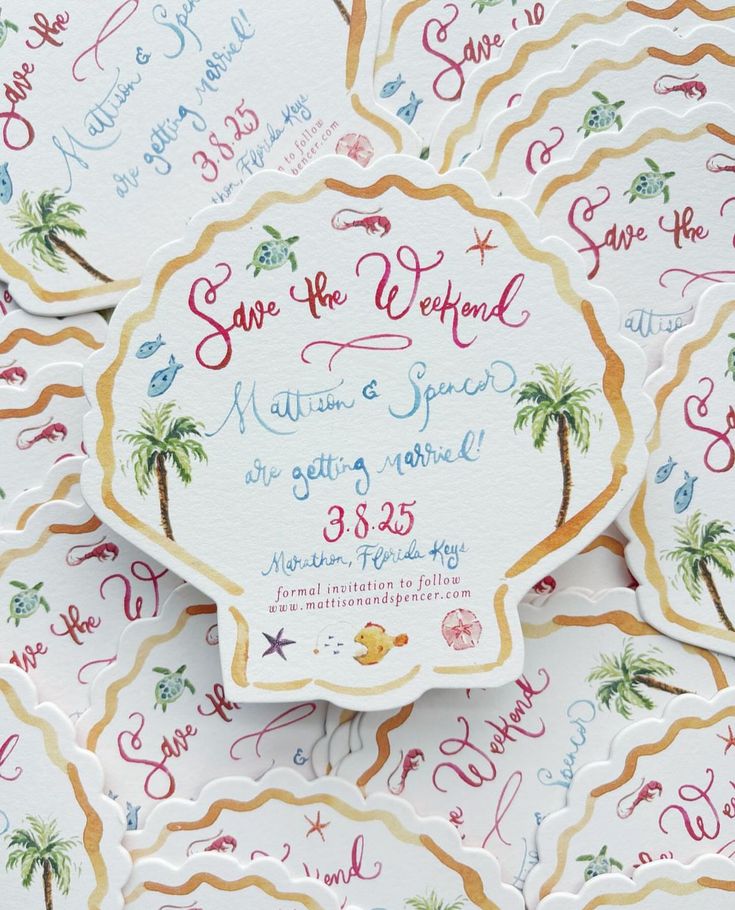 wedding stationery with palm trees and watercolor lettering on white cardstocked in gold foil