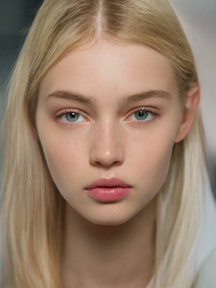 a model with blonde hair and blue eyes