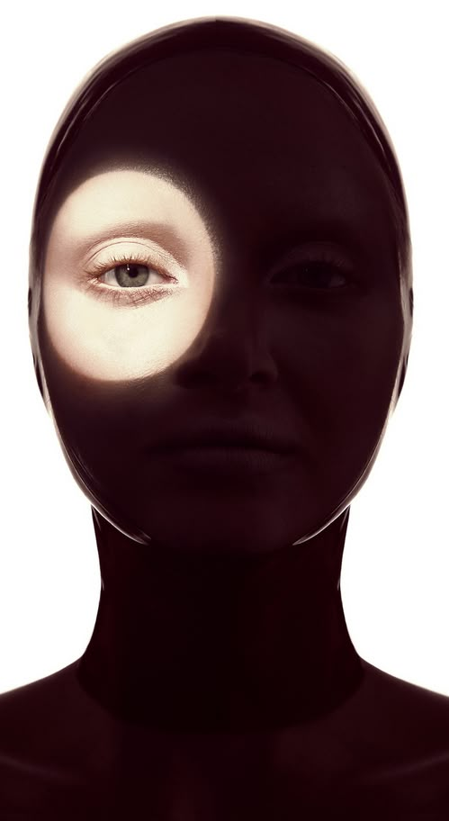 a woman's face is shown with the light coming from her eyes and head