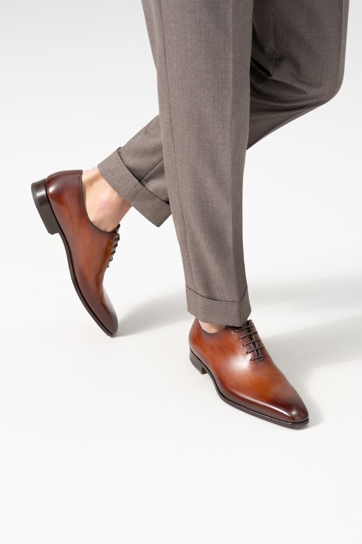 Part of our Magnanni Core Collection, the Cruz is a classic whole cut Oxford. Cut from a single piece of leather, it features a modern and slightly elongated toe box to create a sleek and elegant silhouette. This timeless design provides versatility to be worn for any occasion. Man Shoes Photography, Timeless Fitted Plain Toe Oxfords, Timeless Italian Oxfords For Semi-formal Occasions, Timeless Fitted Pointed Toe Oxfords, Timeless Italian Oxfords In Calf Leather, Timeless Fitted Leather Shoes With Pointed Toe, Formal Fitted Oxfords With Leather Lining, Classic Italian Business Dress Shoes, Classic Italian Crafted Dress Shoes For Business