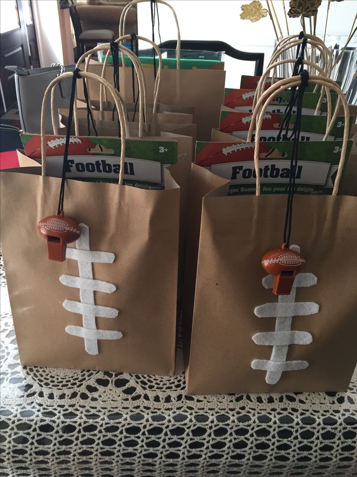 brown paper bags with football decorations on them