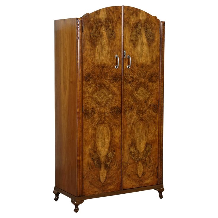 an antique wooden armoire with two doors