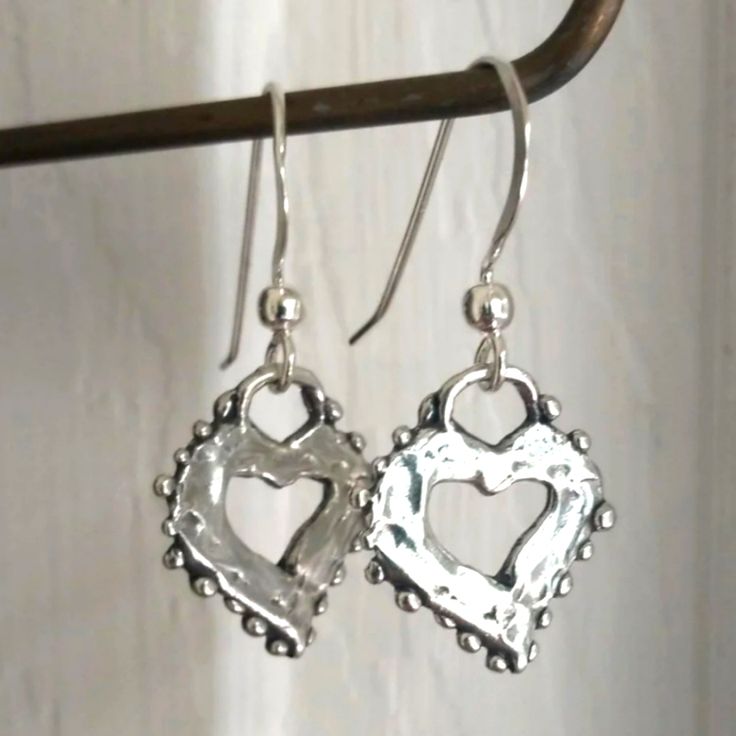 Listing Is For A Pair Of Artisan Sterling Silver Heart Earrings. Handmade, Both Hearts And Earring Hooks Are Solid 925 Sterling Silver. Hearts Measure 17x15mm, With A 1.25-Inch Drop. Earrings Are Gift Wrapped In Eco-Friendly, 100% Recycled Materials That Are Recyclable Themselves. The Photo Of Me Wearing Them Is My Own Personal Pair, But You Will Receive A Brand New Pair. Please Feel Free To Contact Me With Any Questions Or Concerns, And Thanks For Looking! :) Artisan Heart Earrings For Pierced Ears As Gift, Artisan Heart Earrings As Gift, Artistic Heart Earrings As Gift, Artistic Heart-shaped Earrings For Gift, Artistic Dangle Heart Earrings As Gift, Artistic Dangle Heart Earrings For Gift, Artistic Heart-shaped Dangle Earrings For Gift, Artistic Heart-shaped Dangle Earrings Gift, Dangle Heart Earrings As Gift