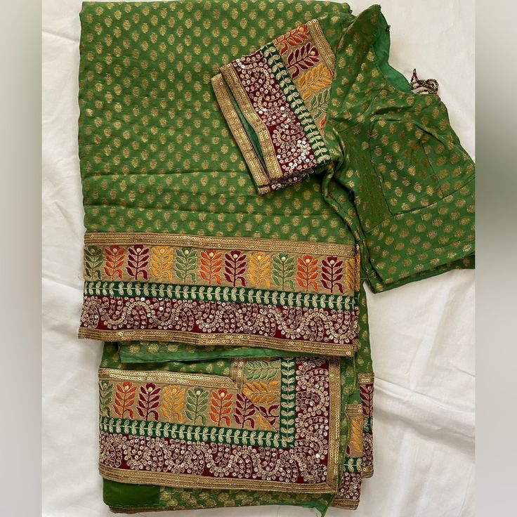 This Is A Brand New Green And Gold, Orange, Yellow And Red Border With A Blouse 38-40 Size Festive Bohemian Blouse With Traditional Patterns, Traditional Green Blouse With Dupatta, Green Blouse With Traditional Patterns And Drape, Traditional Green Blouse With Patterns, Bohemian Green Blouse With Traditional Patterns, Transitional Chanderi Blouse With Bandhani Print, Festive Chanderi Blouse With Bandhani Print, Green Blouse With Traditional Patterns For Puja, Bohemian Blouse Piece With Traditional Patterns In Green