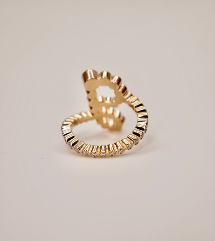 This customizable Ocean Wave-inspired Alphabet Ring, where elegance meets personalization in a captivating tribute to the sea's eternal rhythm. Crafted with exquisite detail, this ring gracefully mirrors the fluid movement of waves, while offering you the opportunity to express your individuality through the alphabet of your choice.Item Details• Made to Order.• Gold Kt: 18K Solid Yellow Gold• Stone Cut: Round• Setting Type: Bezel• Ready to Ship in 15-20 business days If you have any additional q Unique Design Open Ring For Anniversary, 14k Gold Ring With Unique Design, 14k Gold Jewelry With Unique Design For Formal Occasions, Yellow Gold Open Ring With Unique Design, Formal 14k Gold Jewelry With Unique Design, Fine Jewelry In Yellow Gold With Unique Design, Formal Fine Jewelry With Unique Design, Luxury Ring With Unique Design, Elegant Open Ring Jewelry With Unique Design