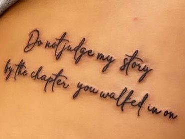 a woman's lower back tattoo with the words don't forget my story