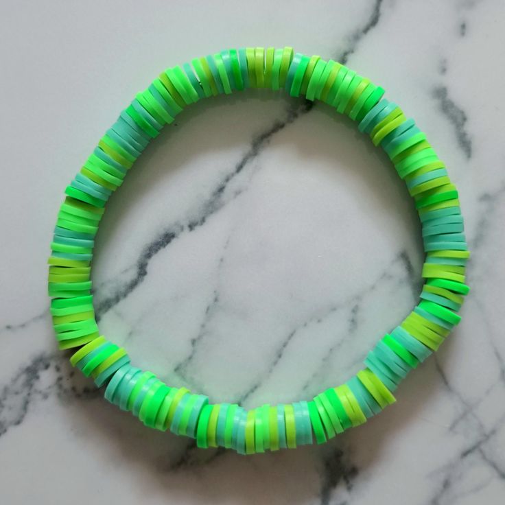 Beautiful beaded bracelet handmade by me. Durable, strong, flexible and stretchy. Fits all. Handmade Inelastic Bracelets With Round Beads, Handmade Inelastic Round Beads Bracelets, Green Beaded Plastic Bracelets, Handmade Green Plastic Beaded Bracelets, Green Plastic Round Bead Jewelry, Green Stretch Bangle Bracelet With Colorful Beads, Green Stretch Bangle With Colorful Beads, Green Stretch Bracelet With Spacer Beads For Beach, Adjustable Green Plastic Beaded Bracelets