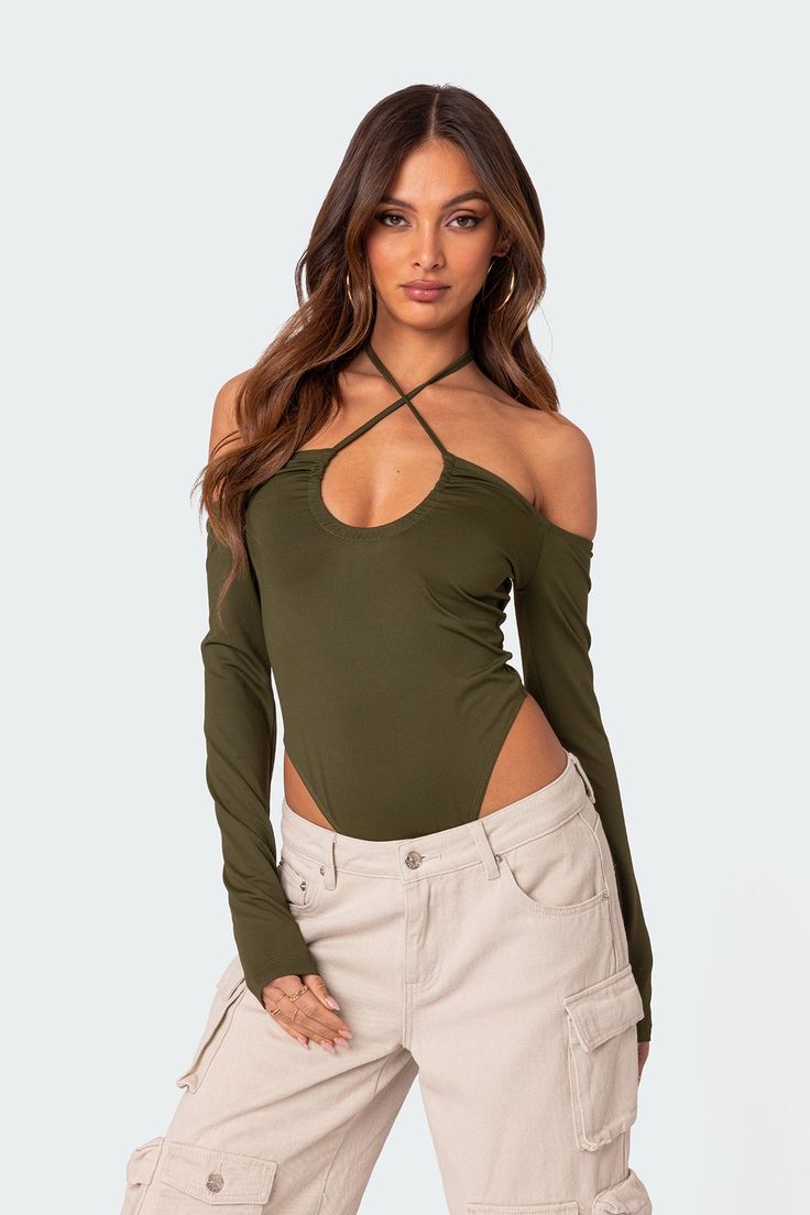 PRODUCT INFO Bodysuit U neckline Off shoulder Halter tie neck Long sleeves Polyester, Spandex Model wears size S Model height is 5'9 Item care: Wash with similar color Strappy Bodysuit, Halter Bodysuit, Bodysuit Designs, Womens Sleeveless Tops, Casual Summer Tops, Cropped Tube Top, Asymmetrical Tops, Casual Tops For Women, Dressy Tops