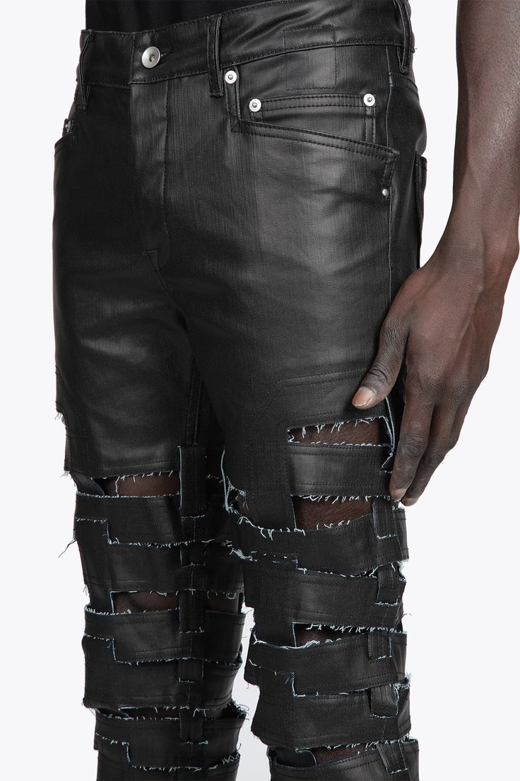 Rick Owens DRKSHDW Spartan Jeans Designer's ID: DU01B7360-SBKM With a snug skinny fit and low rise, these jeans hug all the right curves. The unique Spartan design is sure to turn heads, with horizontal raw cut straps interlocking with vertical straps running up the centre back and legs. Plus, the light-weight stretch denim has a black matte finish that's just irresistible. Color: Black Composition: 91% COTTON+6% ELASTOMULTIESTE, 3% RUBBER. Made In ITALY Edgy Fitted Distressed Pants, Urban Fitted Distressed Bottoms, Edgy Ripped Fitted Jeans, Edgy Fitted Jeans With Five Pockets, Fitted Straight Leg Leather Pants For Streetwear, Urban Ripped Fitted Jeans, Urban Style Ripped Fitted Jeans, Edgy Black Leather Jeans, Urban Distressed Fitted Jeans