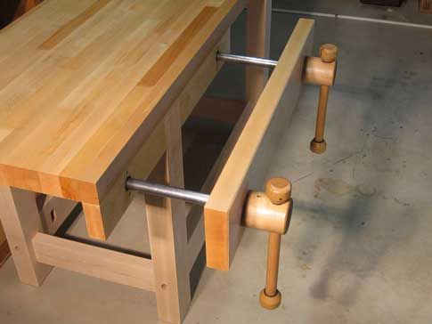 a wooden table with two handles on it