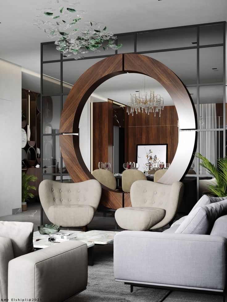 a living room filled with furniture and a round mirror