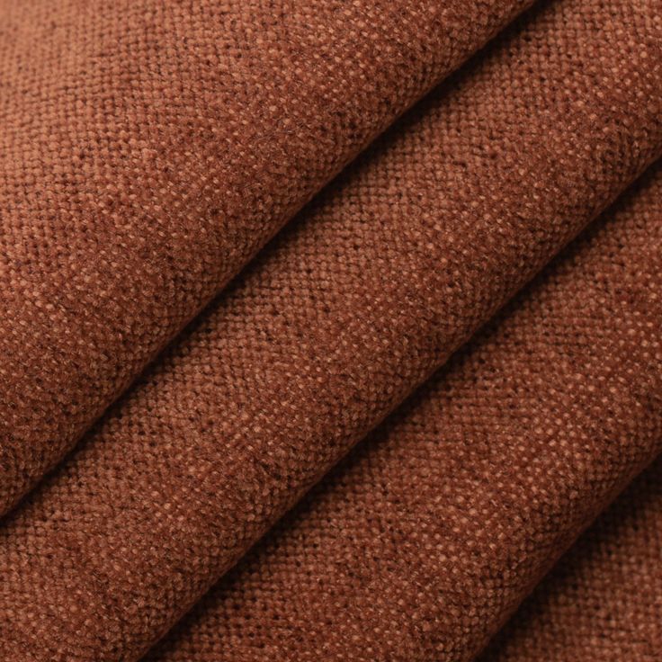 brown fabric textured with small dots on the top and bottom, as well as an orange background