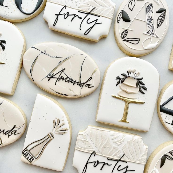 decorated cookies with writing on them are arranged in the shape of letters and numbers that spell out their names