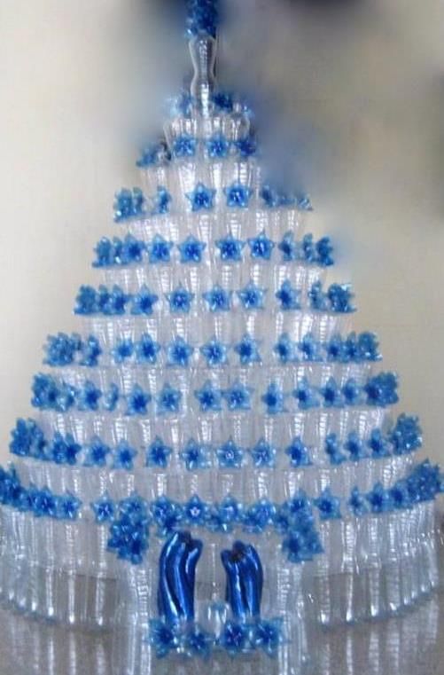 a blue and white christmas tree made out of empty water bottles