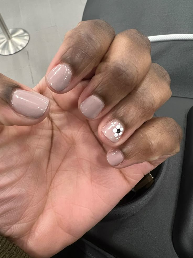 Short nails with nude nylon gel color and a white flower design on ring finger, in the bottom corner of the nail. Boy Manicure Ideas, Masculine Nail Designs Men, Stud Nail Designs, Masculine Nail Designs, Gell Nails, Mens Nails, Studded Nails, Hard Nails, Flower Nail Designs