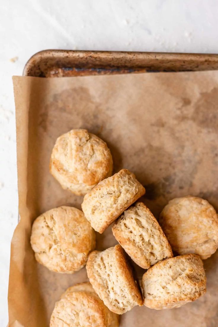 some biscuits are sitting on a piece of parchment paper