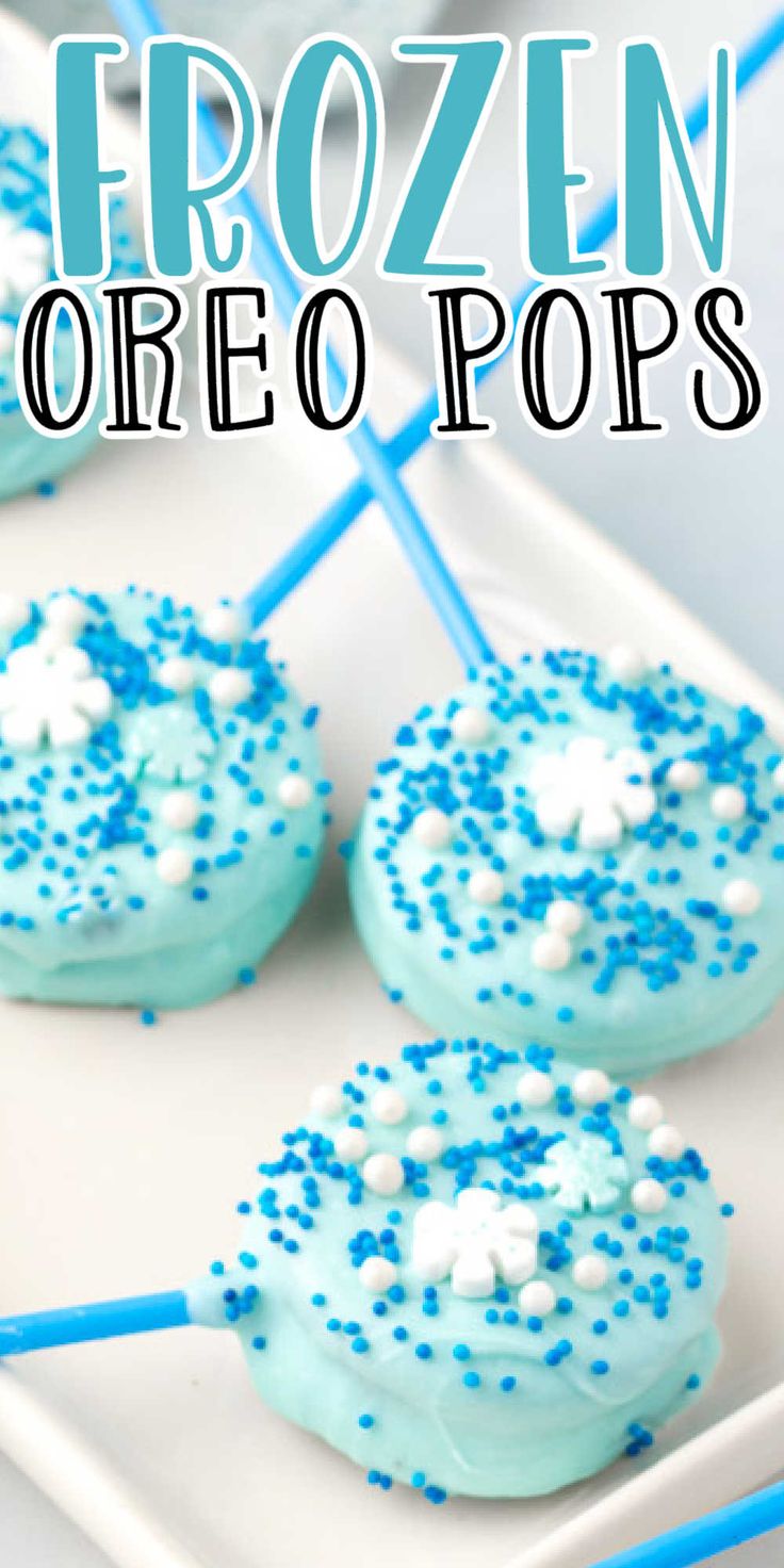 frozen oreo pops on a white plate with blue and white sprinkles