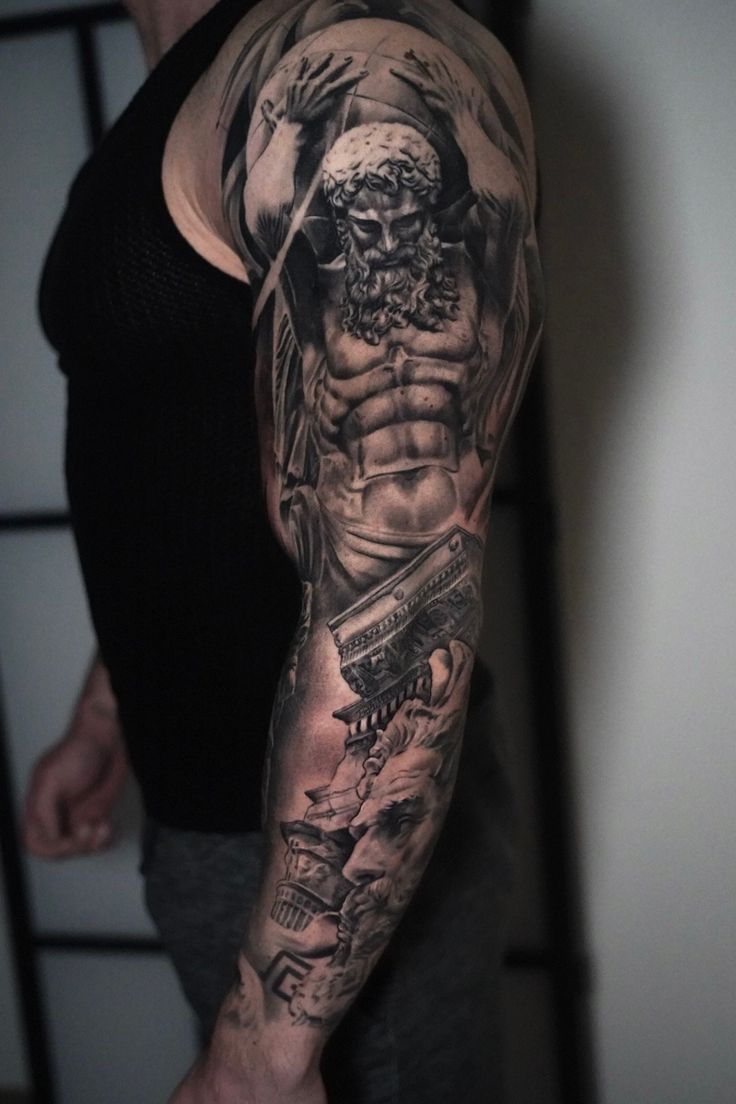 a man with a tattoo on his arm